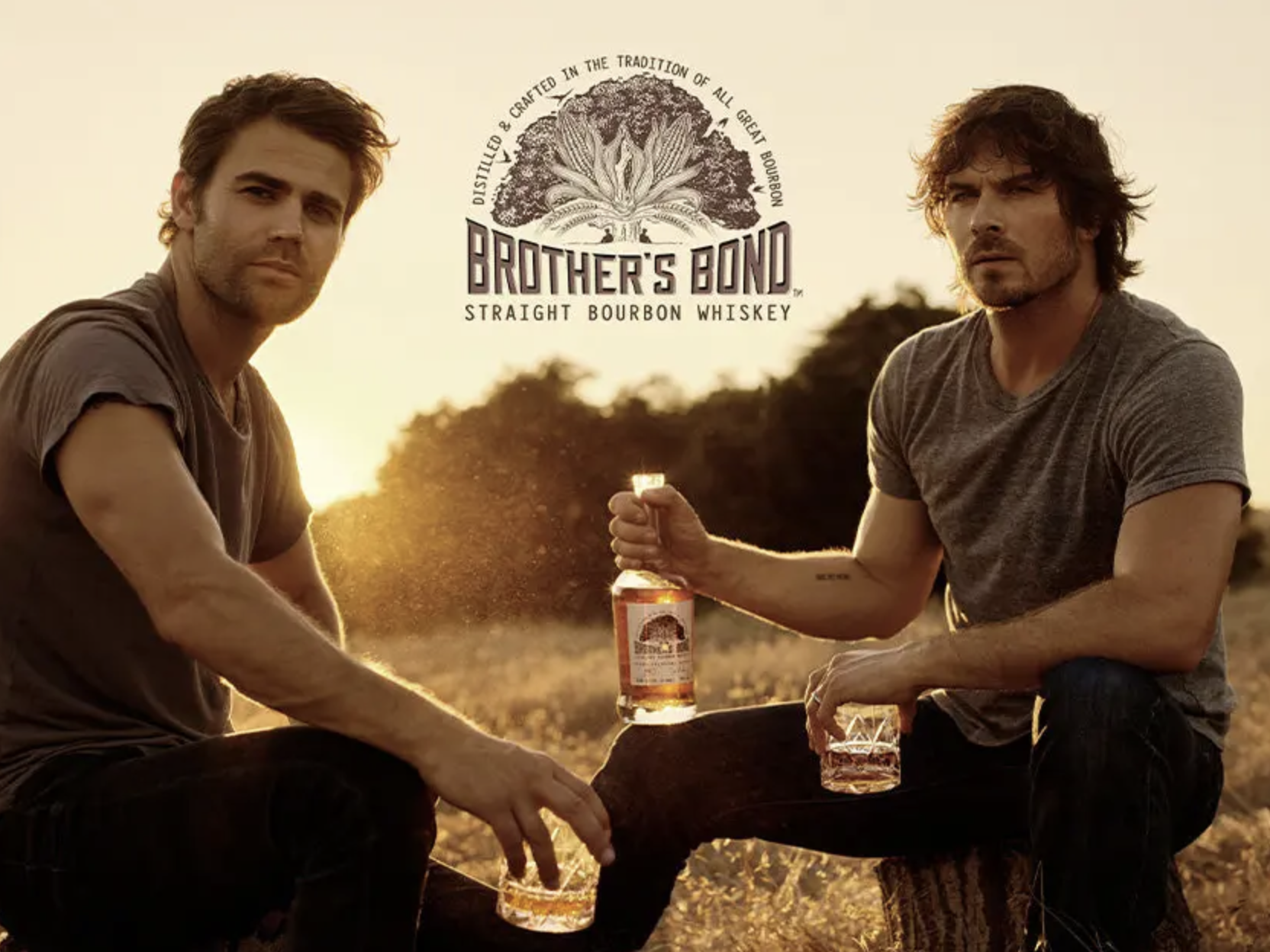 Ian Somerhalder and Paul Wesley posing with their brothers bond bourbon