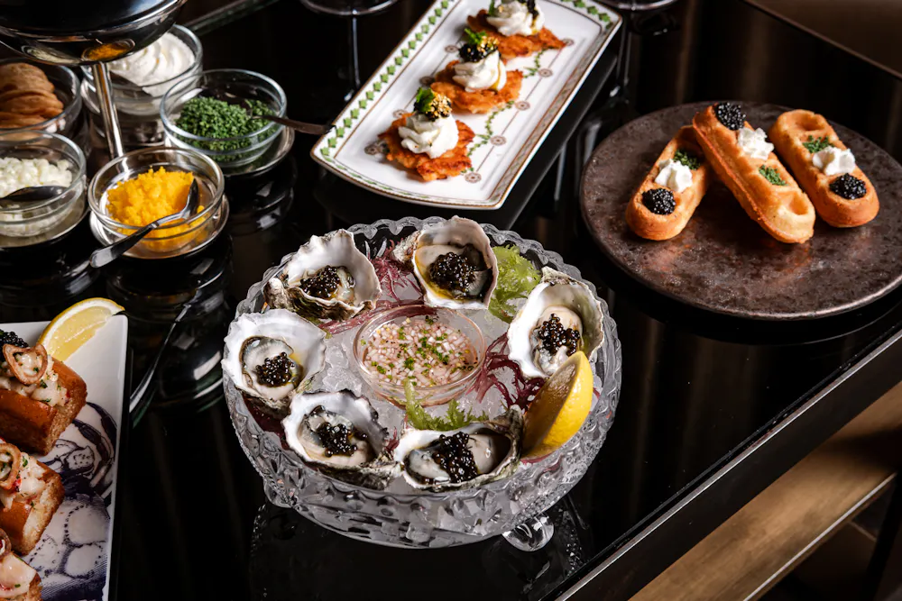 Caviar Bar, Caspian's Rock & Roe Menu items spread out on a table