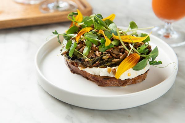a white plate topped with a sandwich and a salad