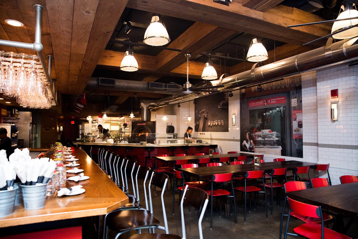 a kitchen with a dining table in a restaurant