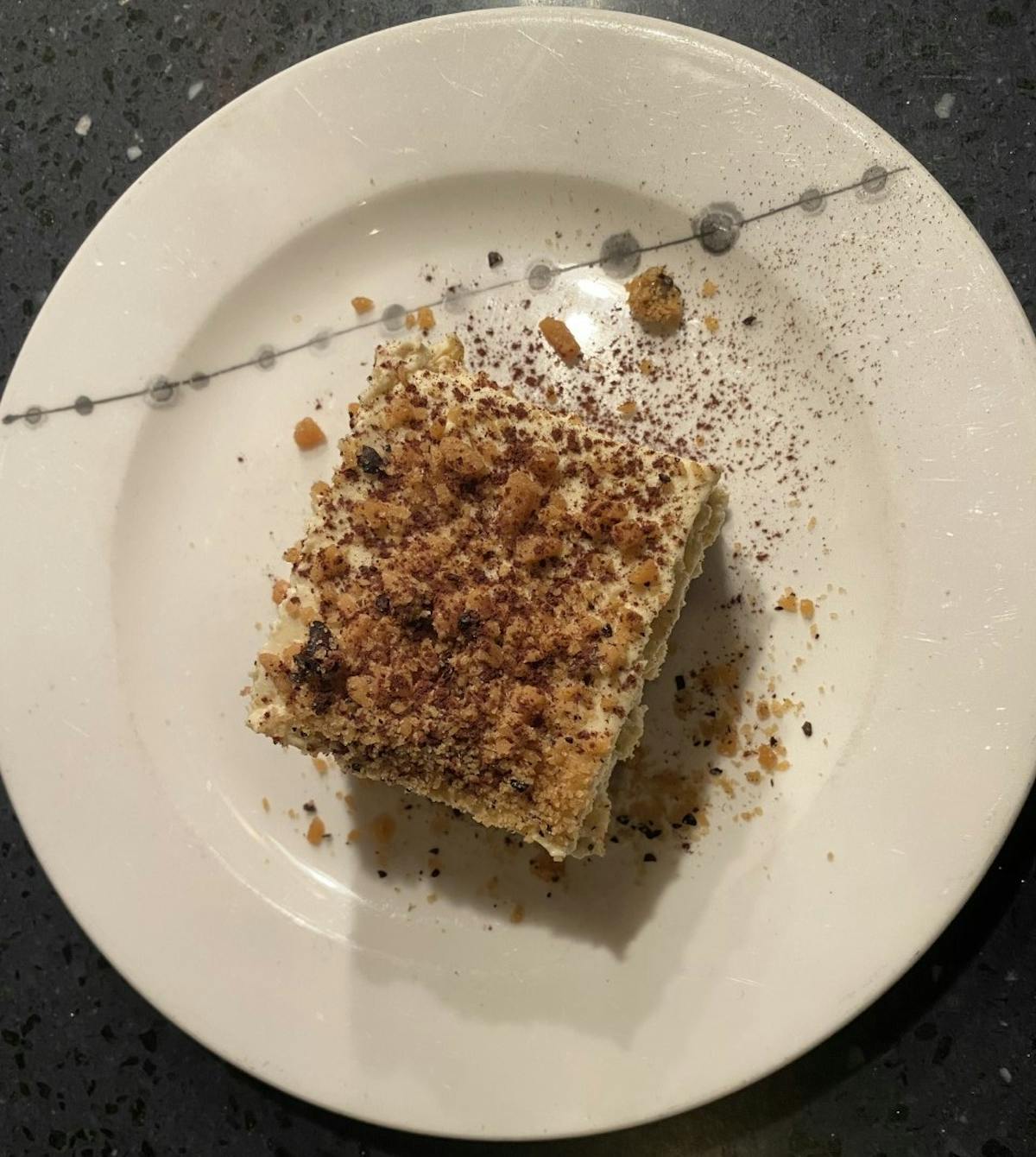 a plate with tiramisu on it