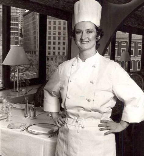 a person standing in a kitchen