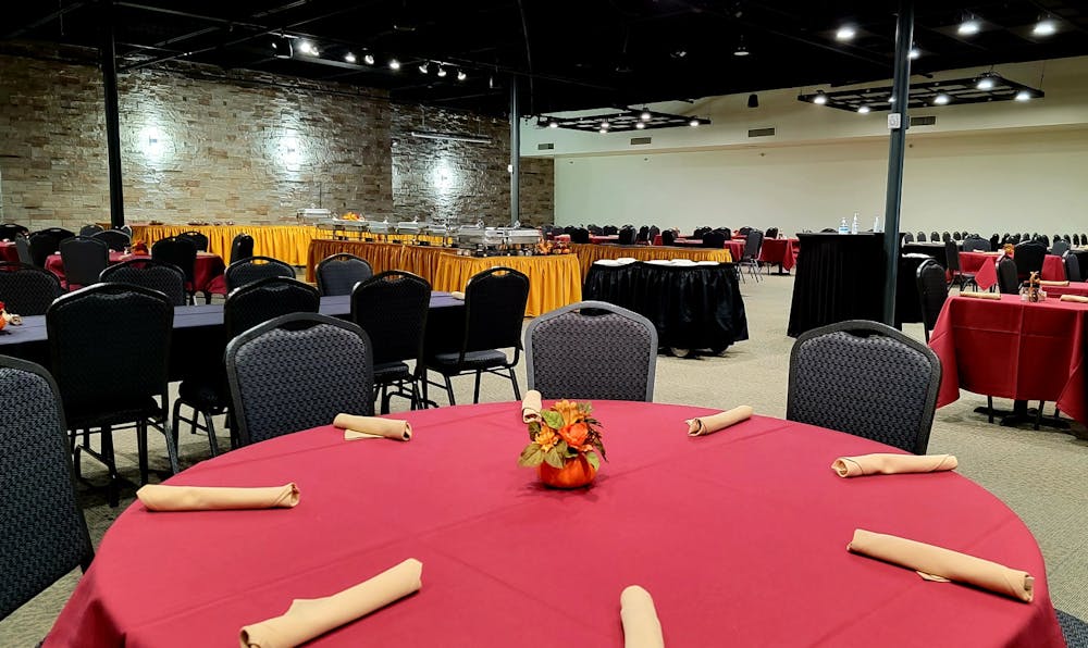 a group of people sitting at a table in a room