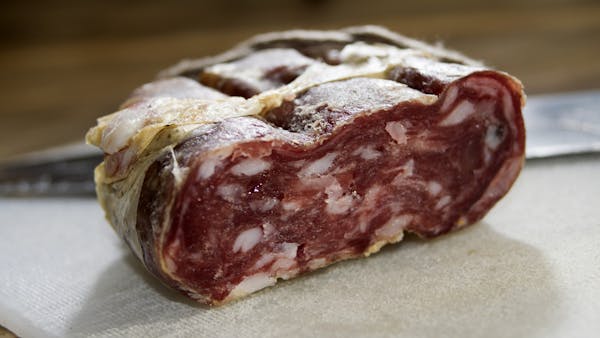 A close up of the the cross section of soppressata salami.