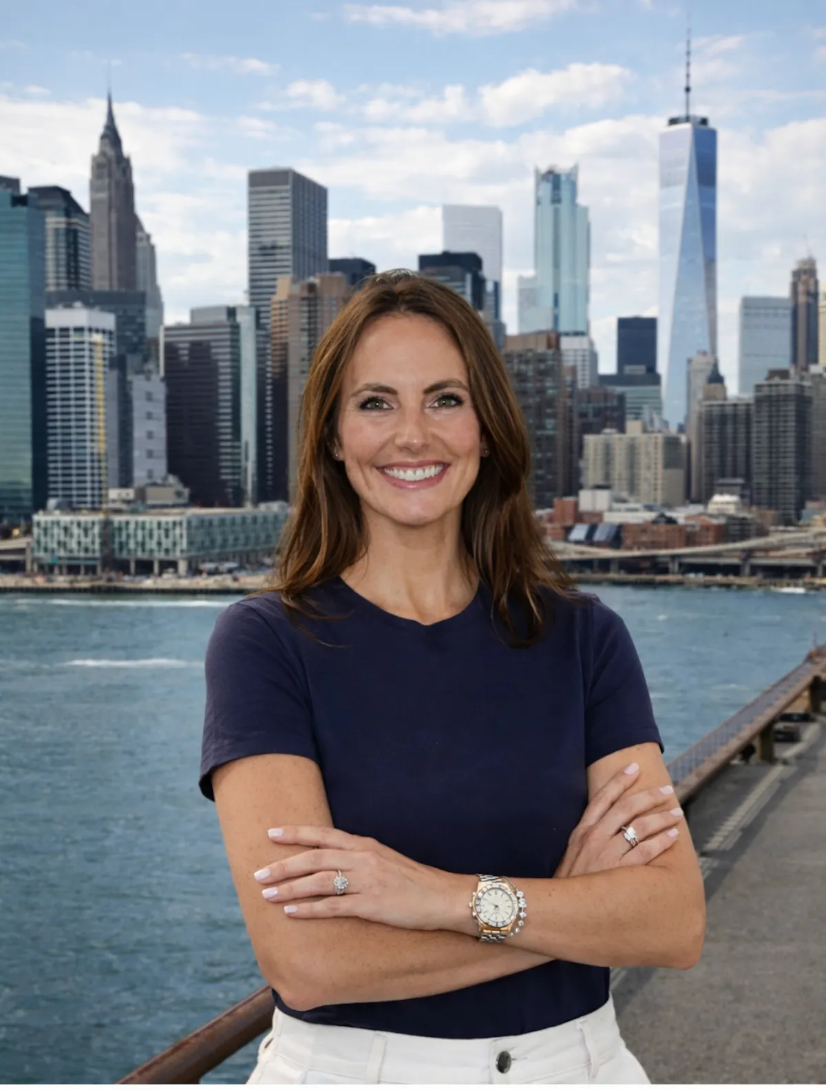a woman standing with her arms crossed in front of a city