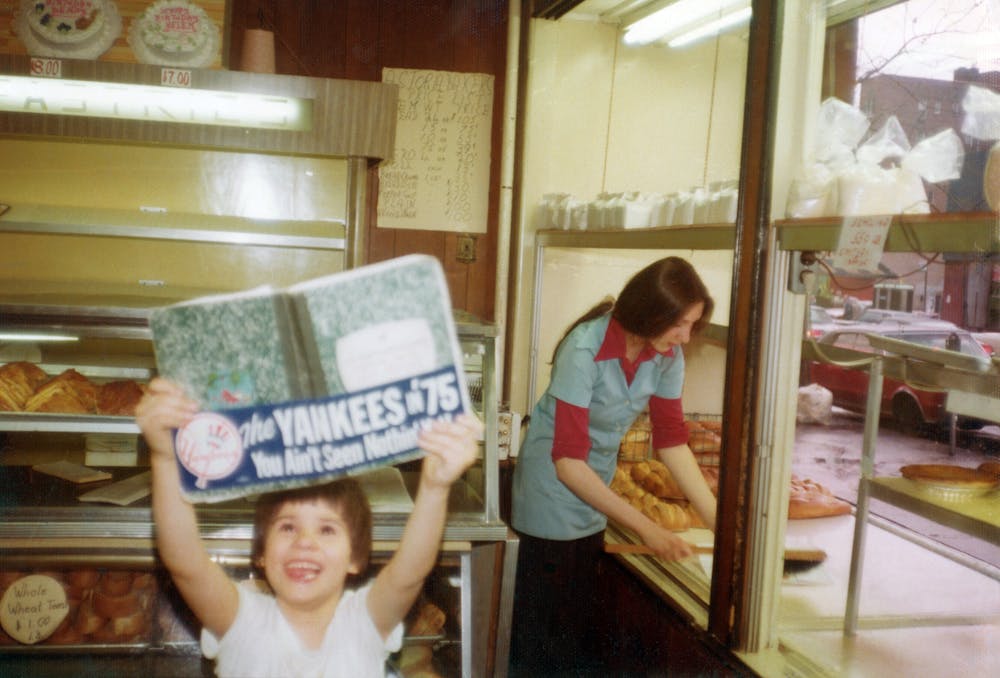 a girl sitting on a table