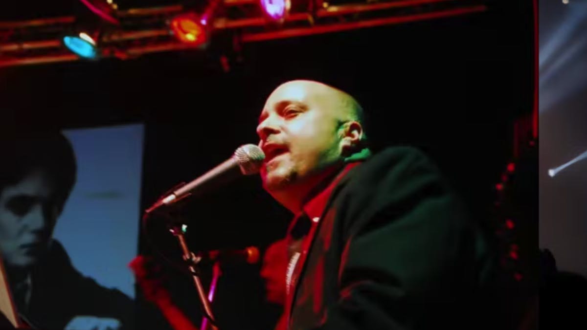 a man holding a microphone