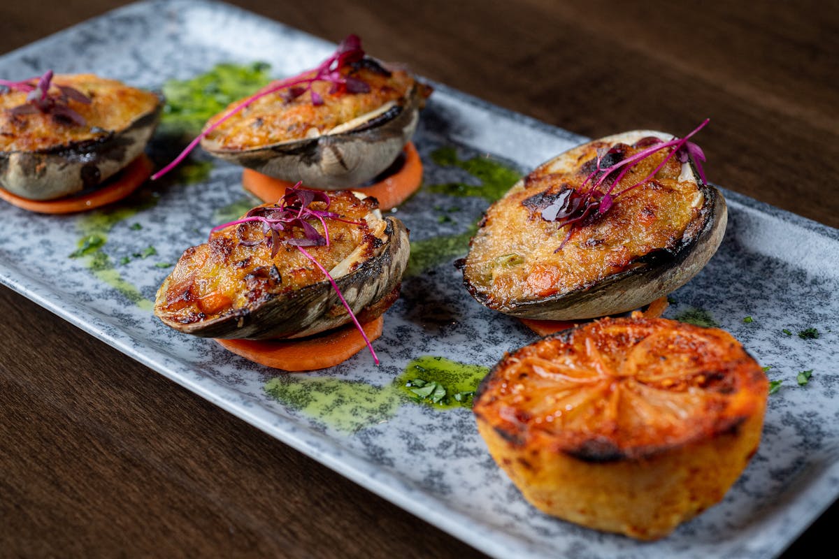 a plate of food sitting on top of a wooden table