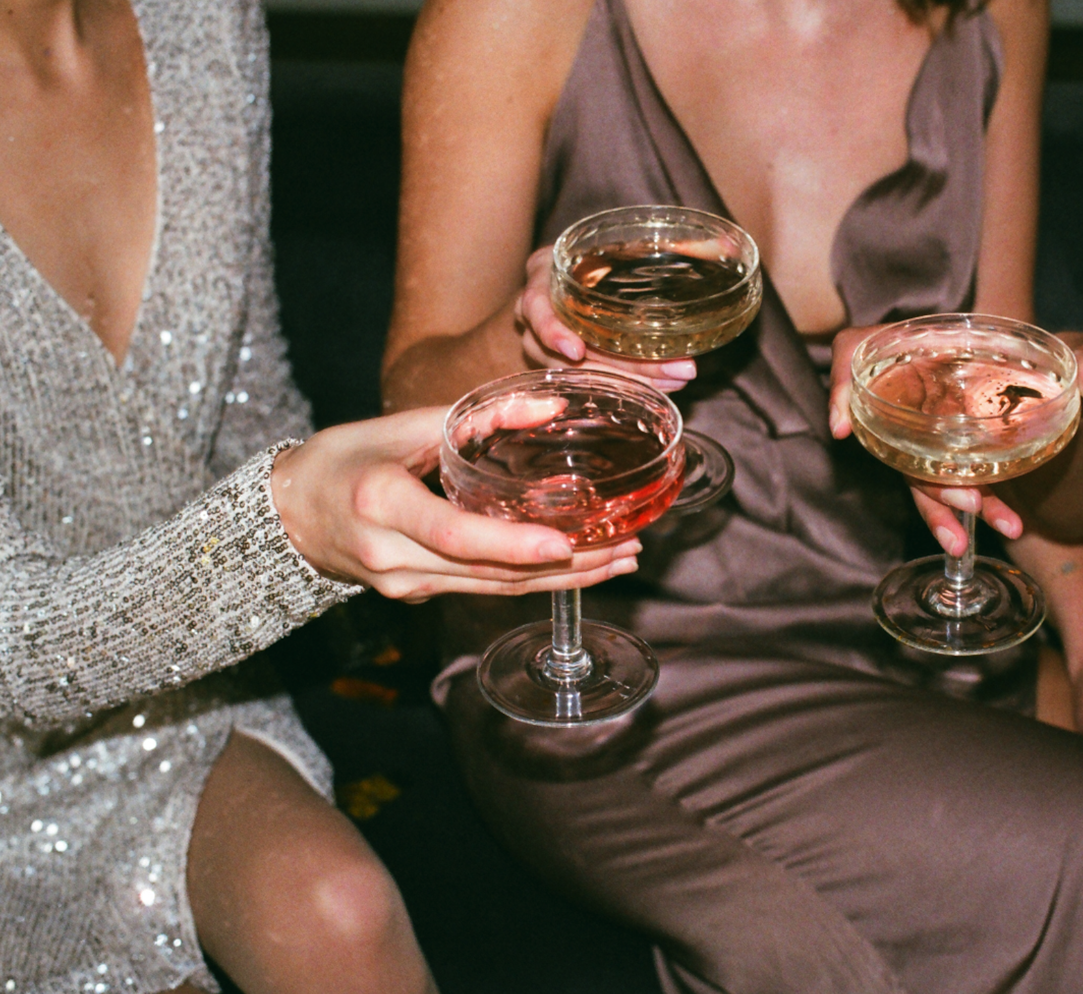 women cheering cocktails