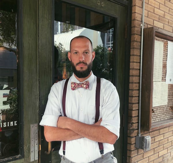 a man standing in front of a building
