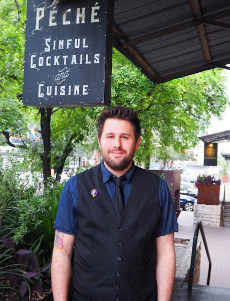 a man standing in front of a sign