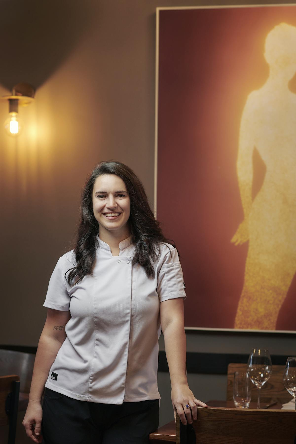 a person standing in front of a mirror posing for the camera