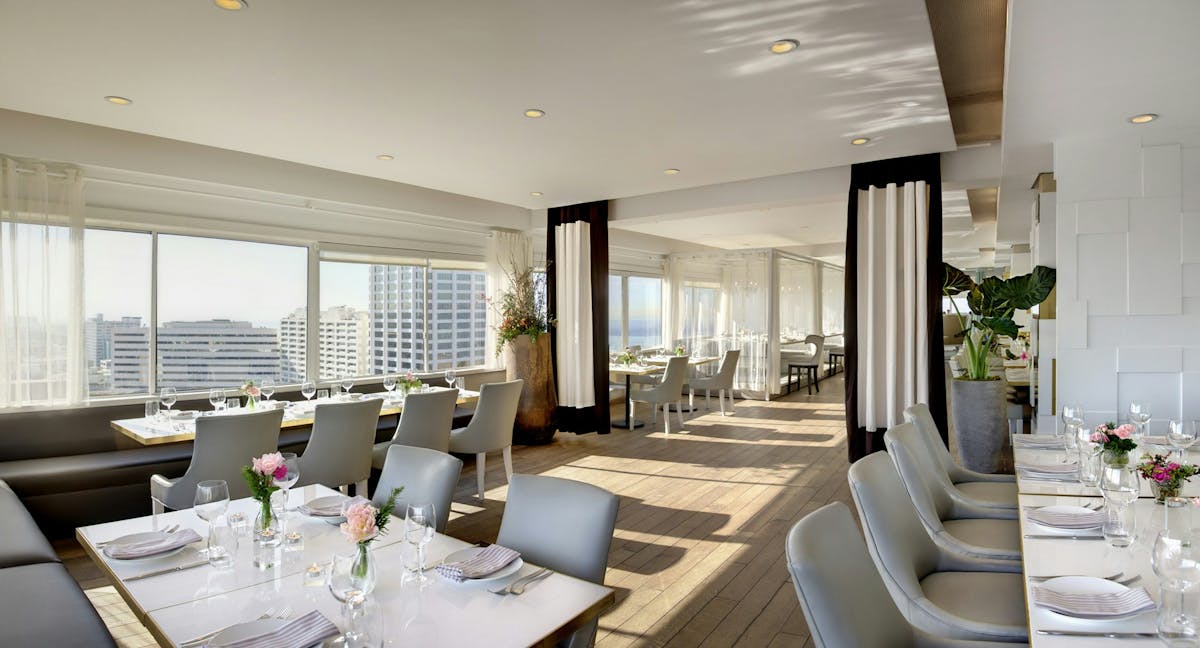private dining space in The Penthouse restaurant with tables and chairs