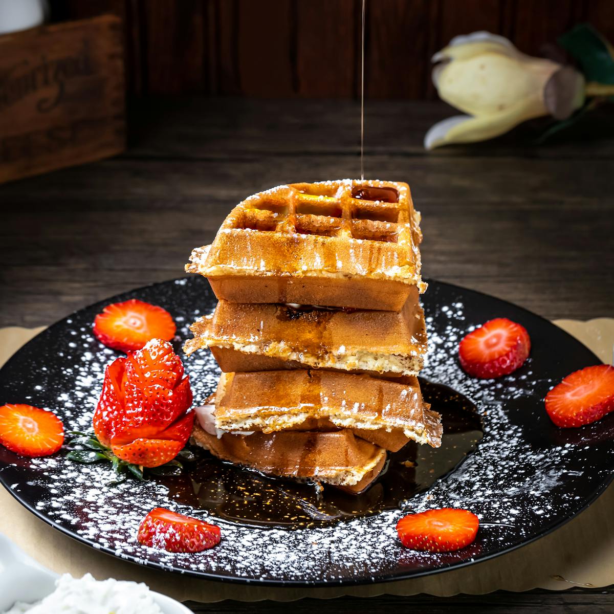 waffles on a plate garnished with strawberries