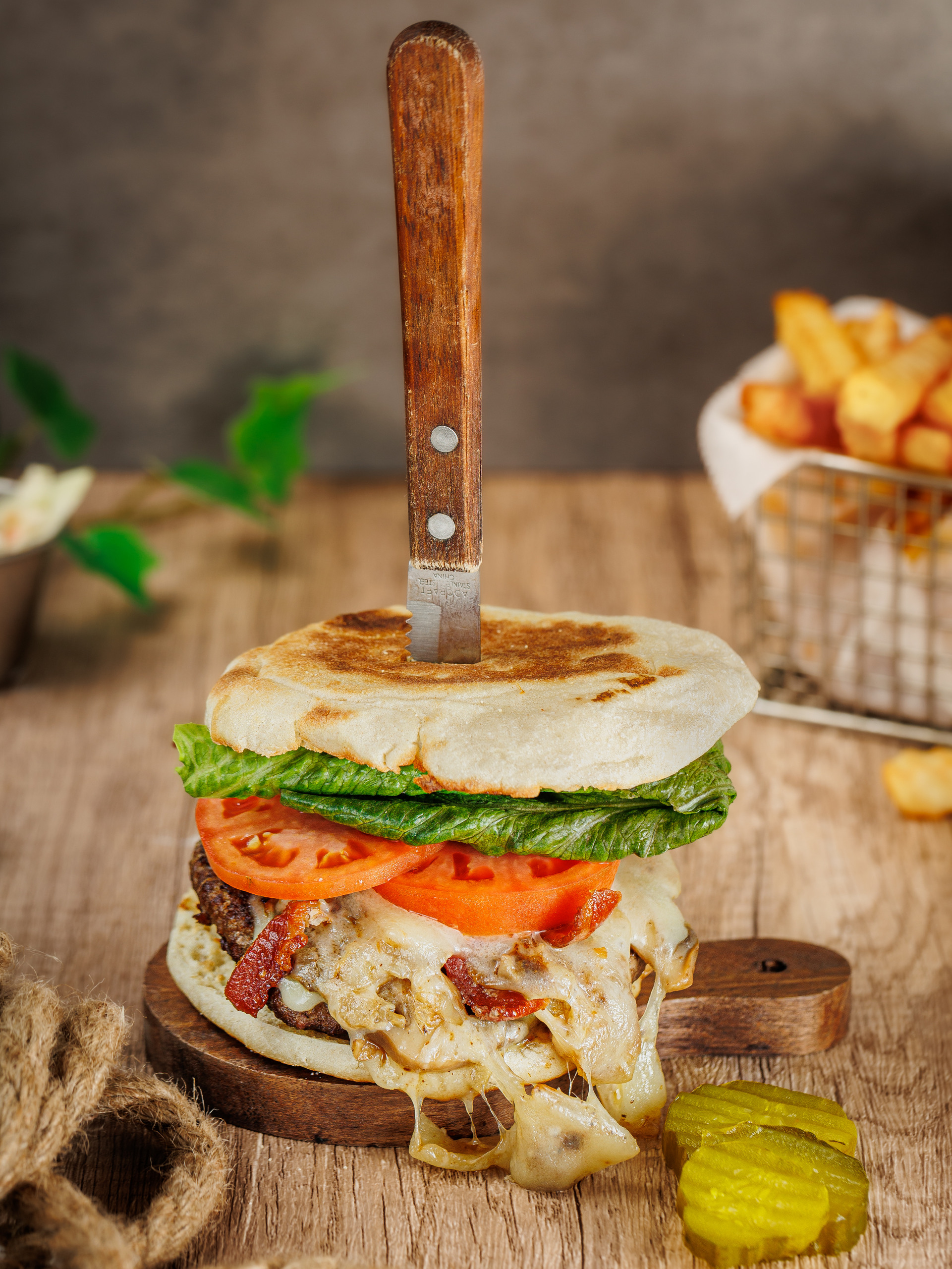 a sandwich sitting on top of a wooden cutting board