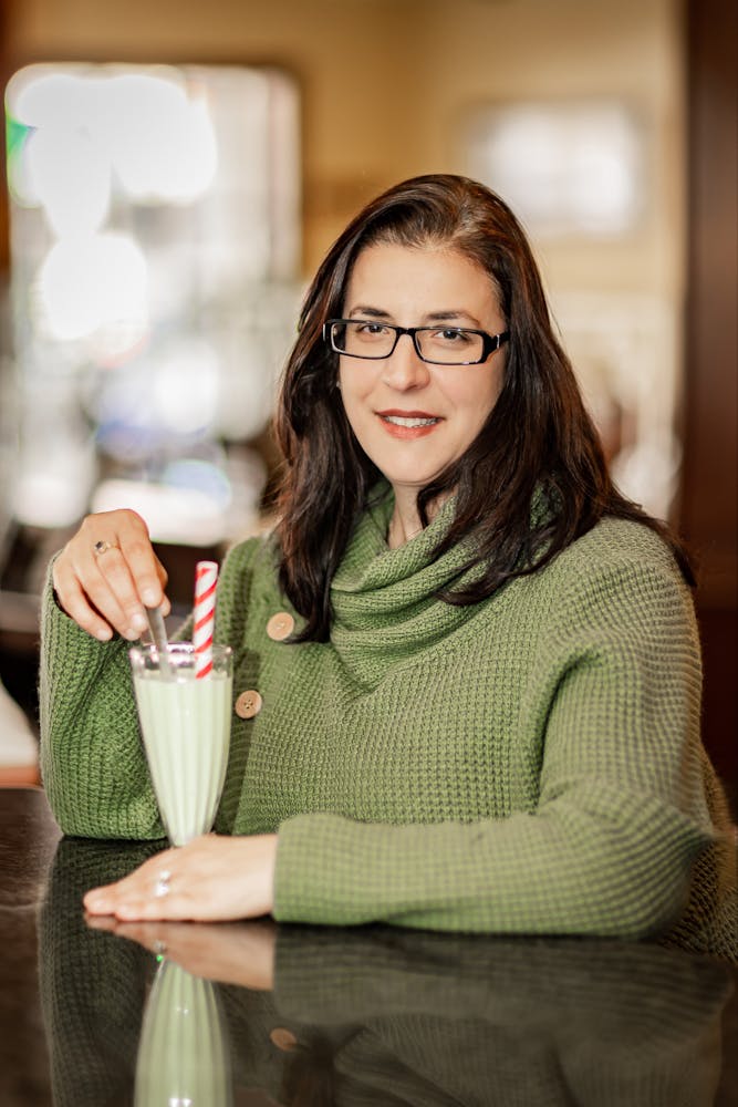 a woman holding a wine glass