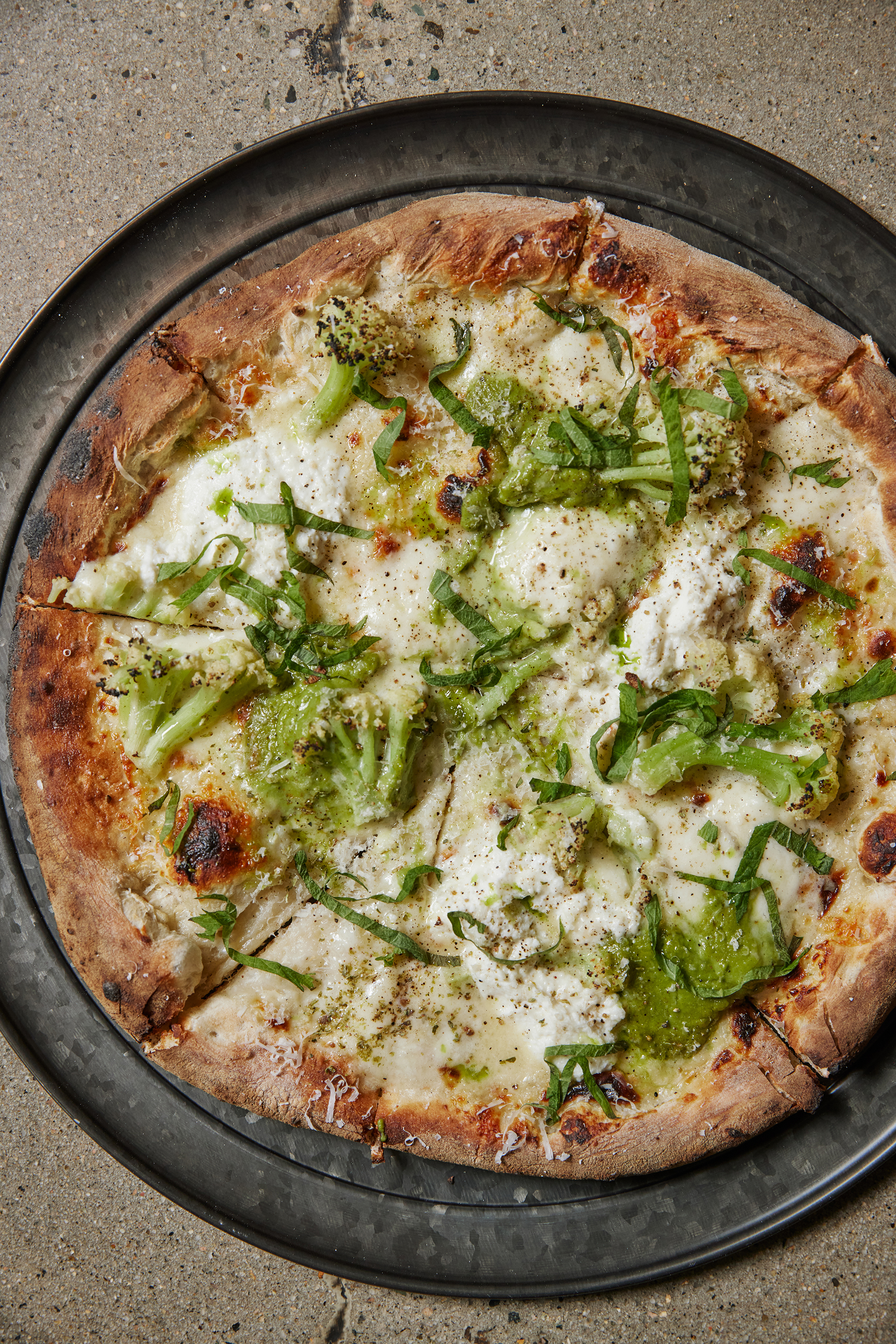 a pizza sitting on top of a pan