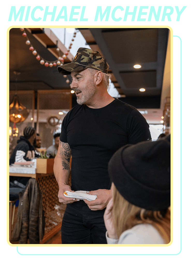 a man standing in front of a screen