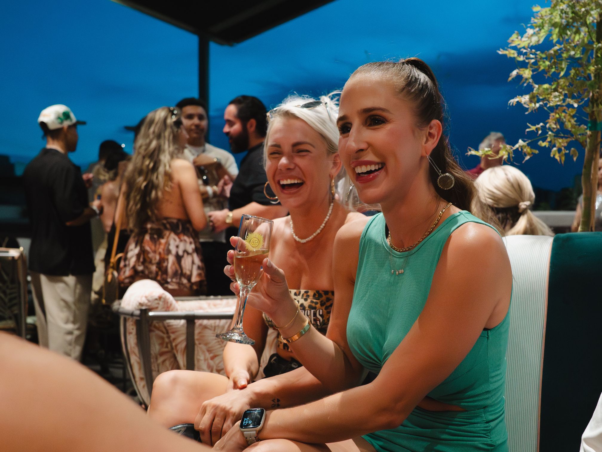 women on rooftop having fun