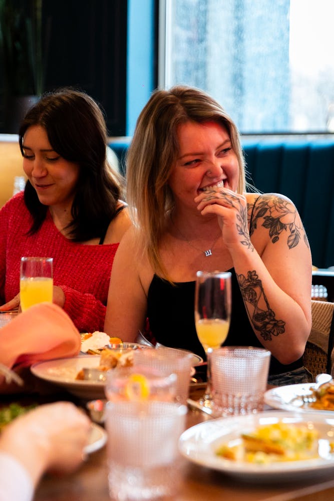 Women enjoying and laughing during brunch