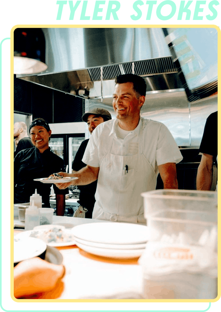 a man preparing food in a restaurant