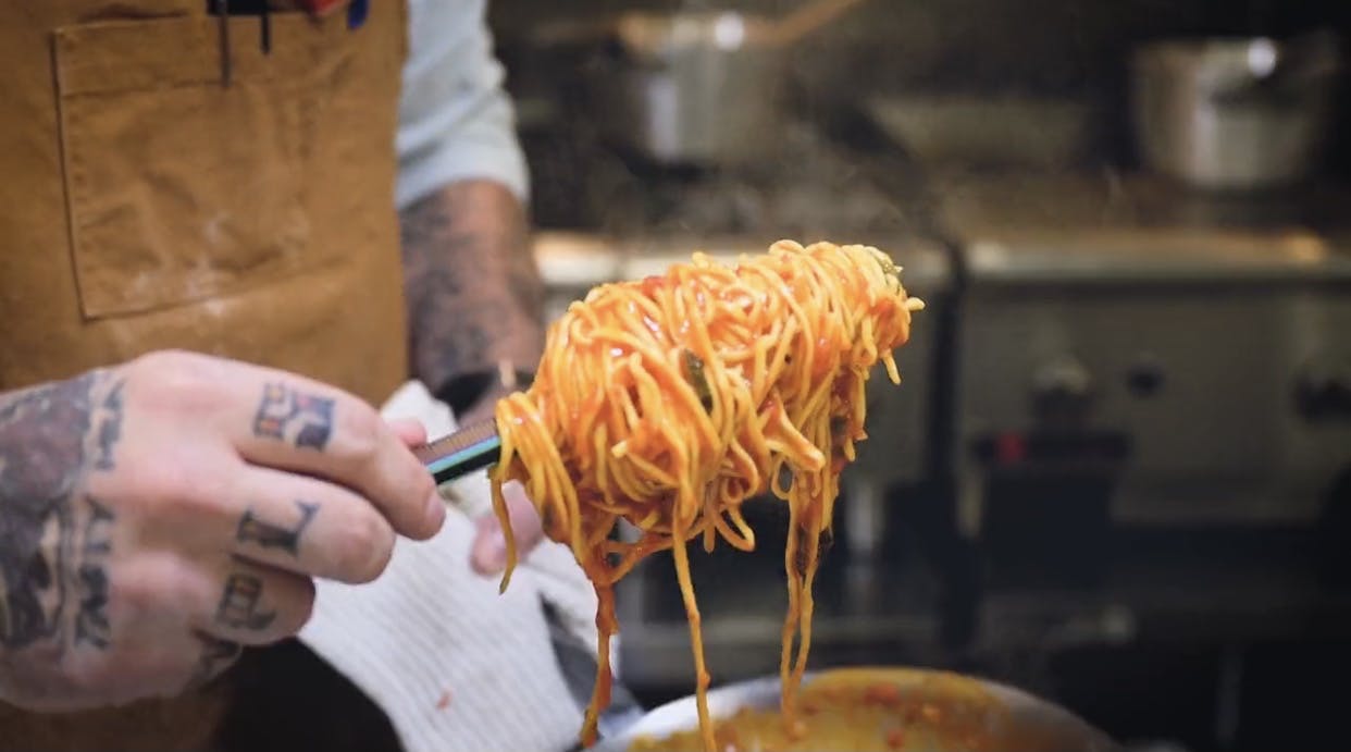 a person cutting food on a table