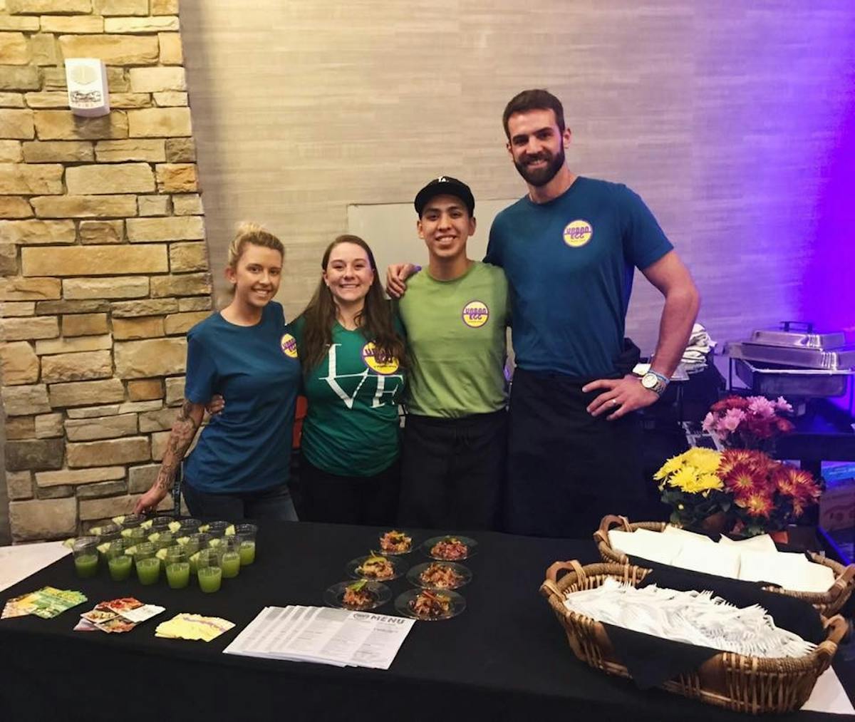 4 Staff Members Behind a Table for Catering Event