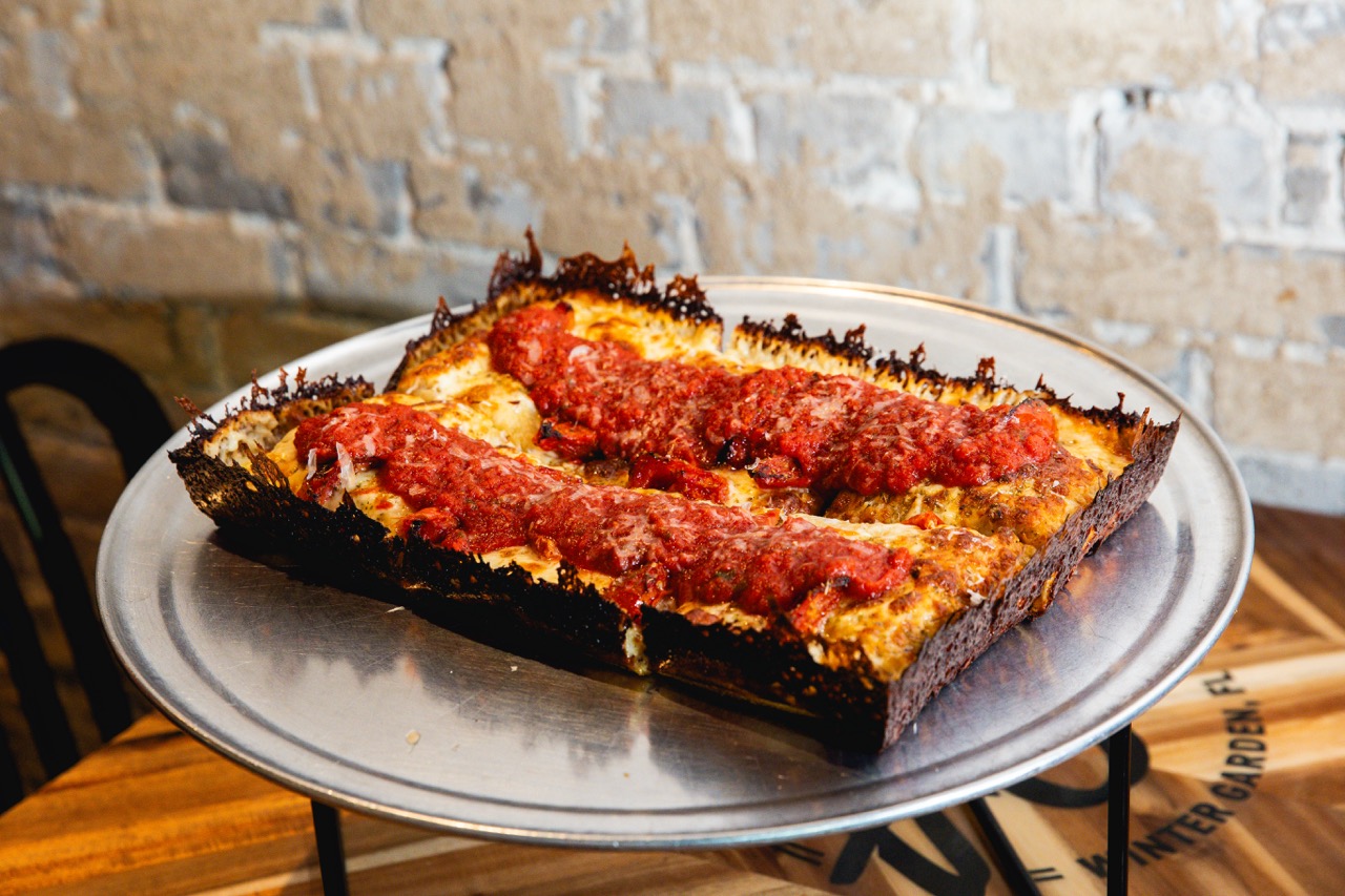 Topped with Balaria roasted tomatoes, fresh basil and Grana Padano parmesan
