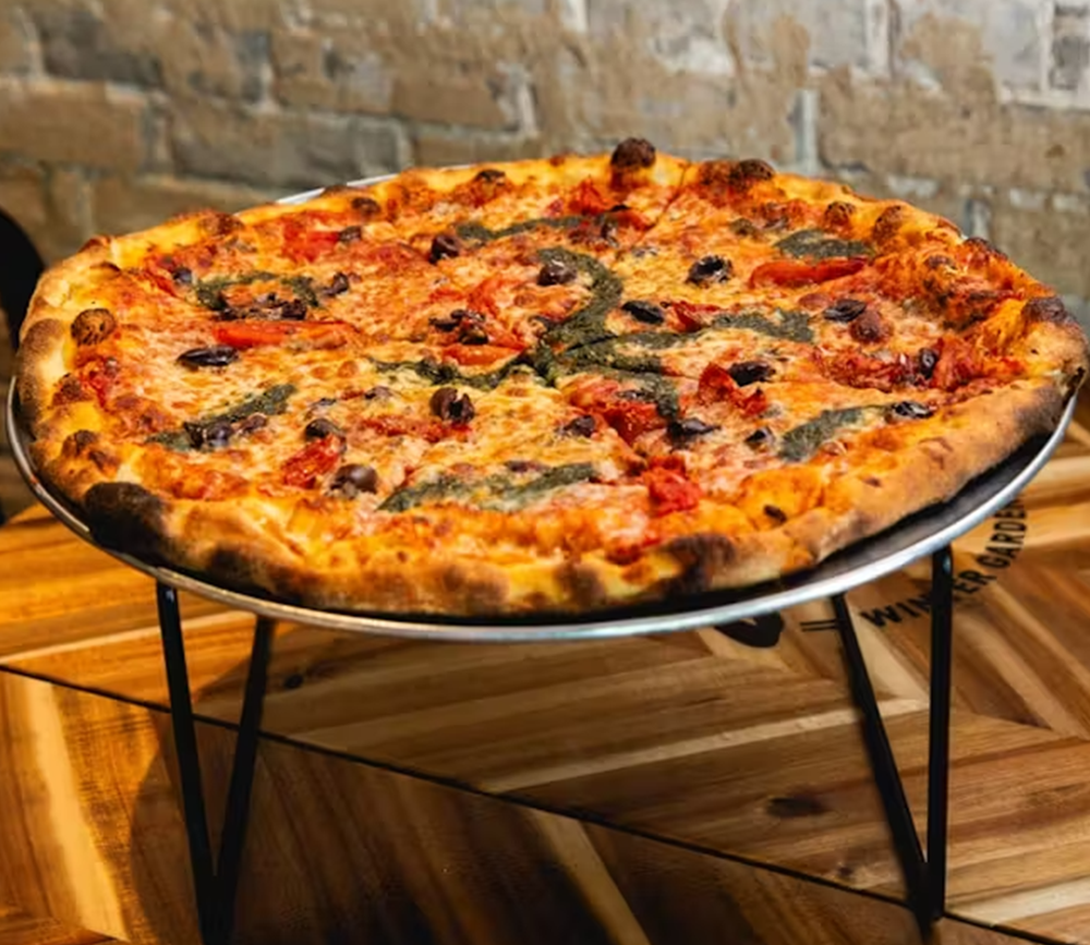 a pizza with different veggies and proteins