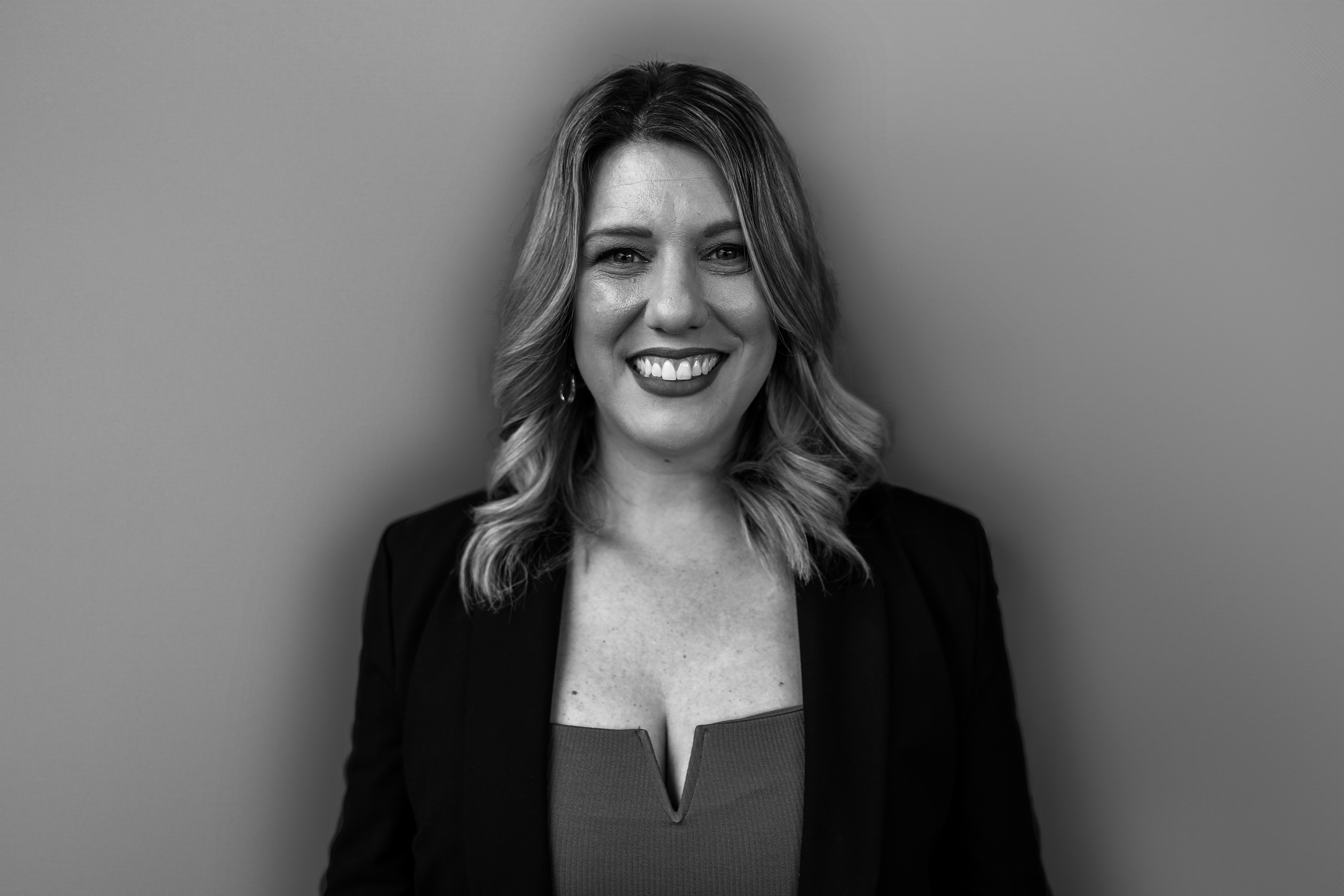 a woman who is smiling and looking at the camera