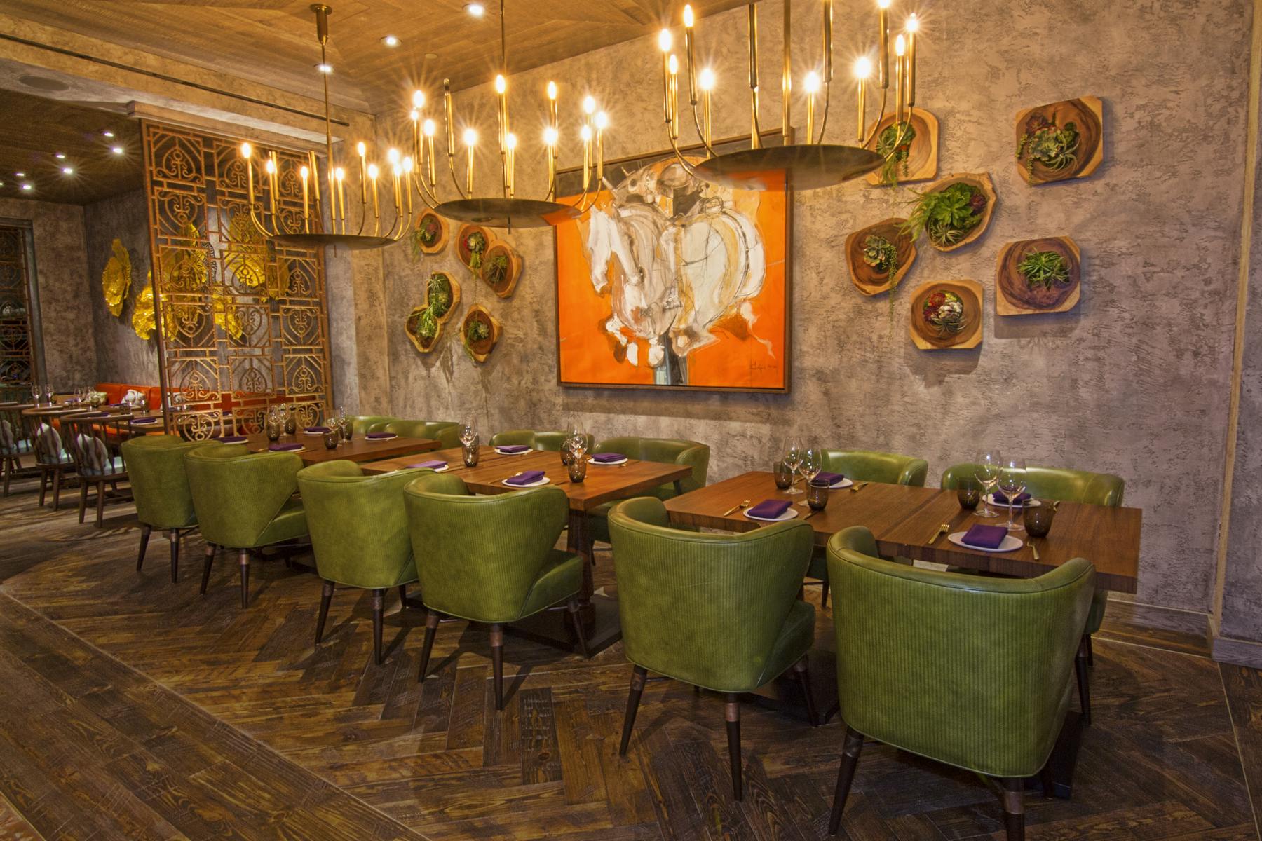 a room filled with lots of green leaves