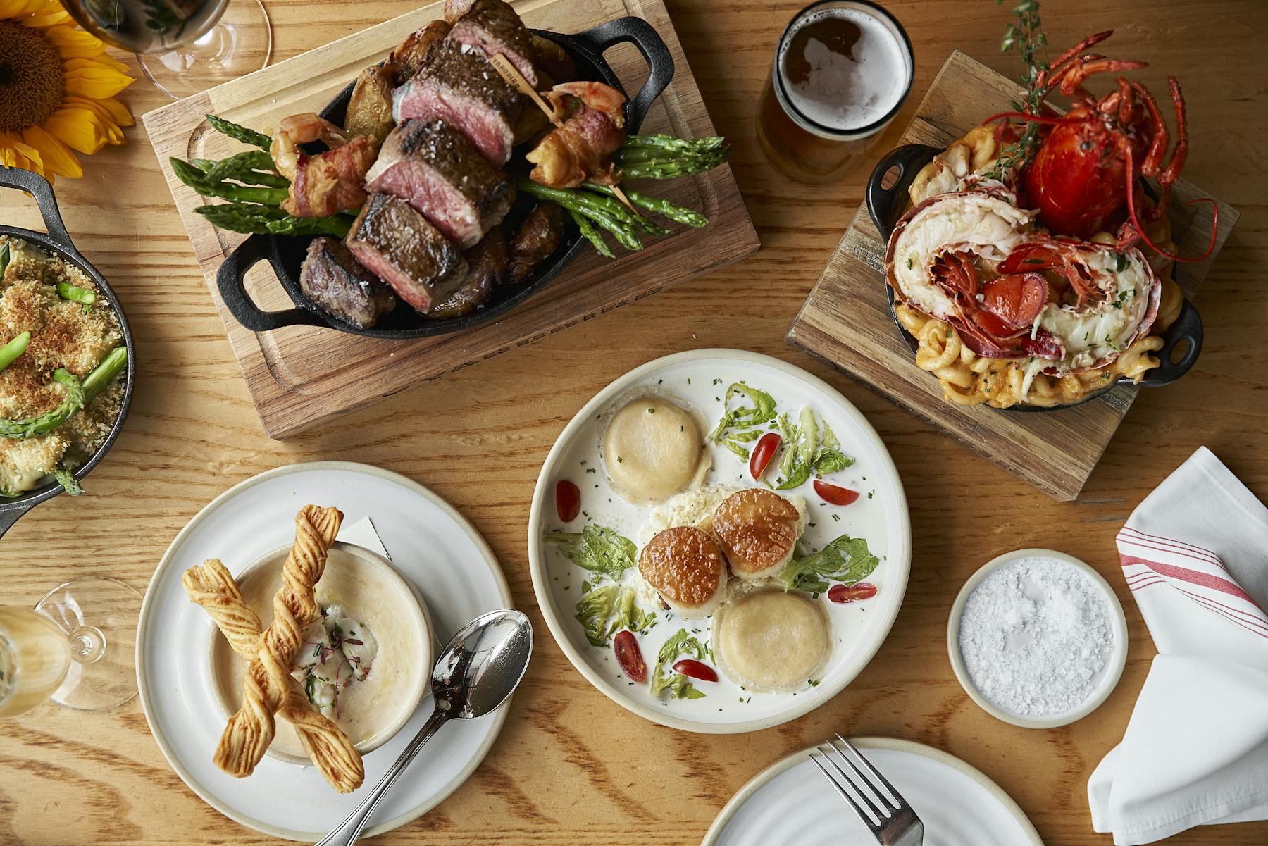 a bunch of food sitting on top of a wooden table