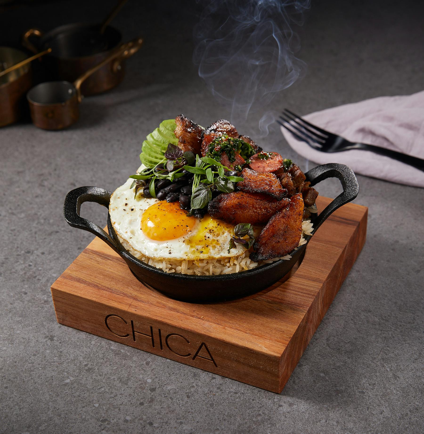 a plate of food sitting on top of a wooden table