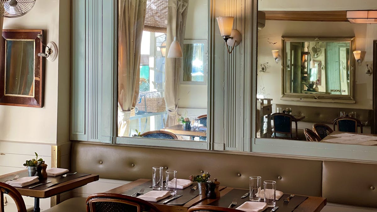 a kitchen with a sink and a mirror