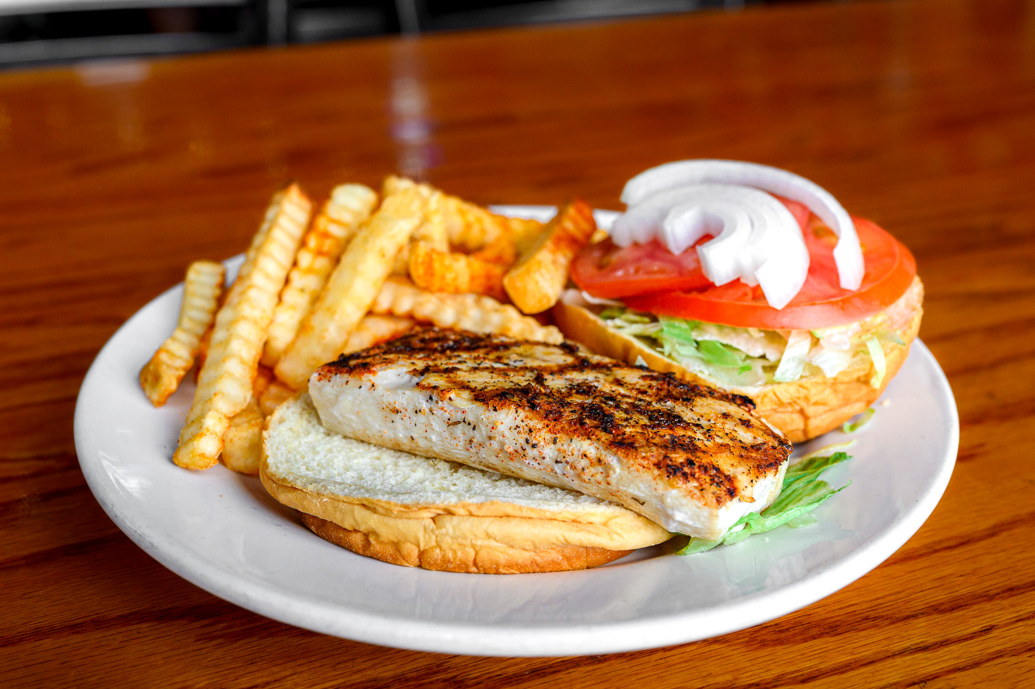 a plate of hot dogs sitting on a table