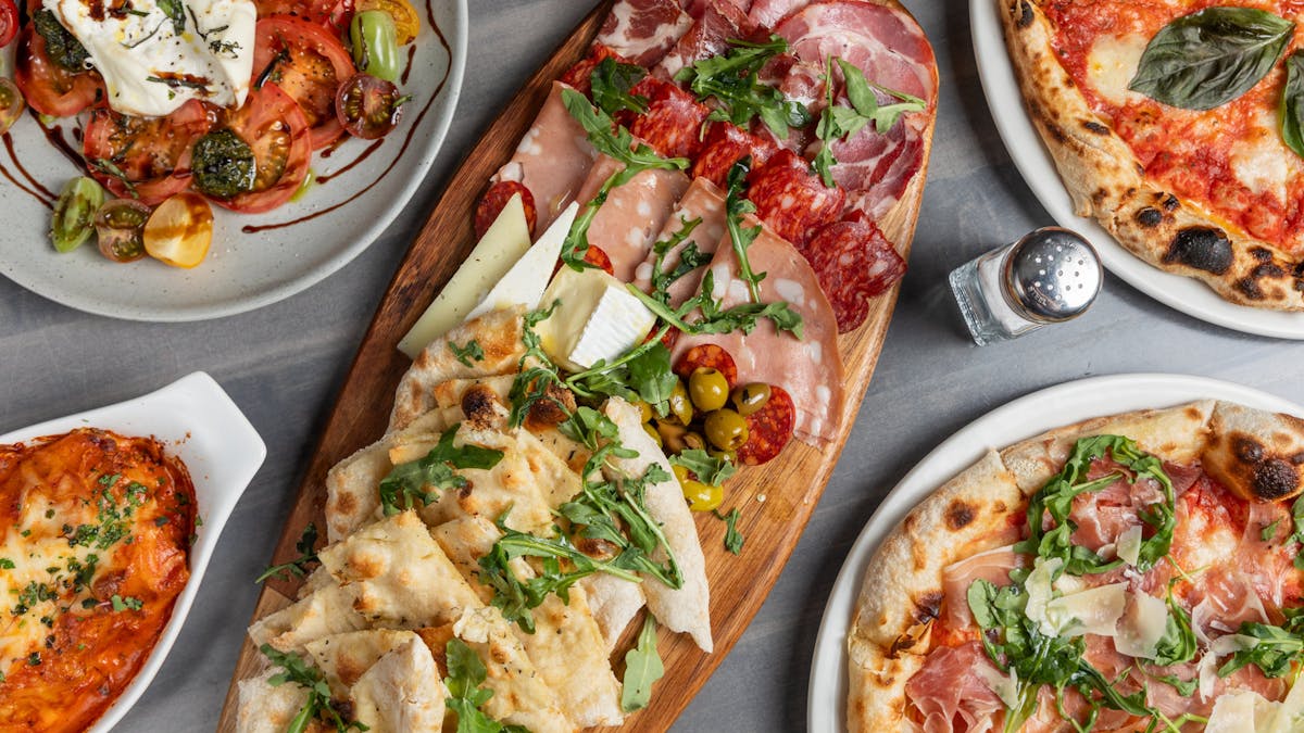 a box filled with different types of pizza