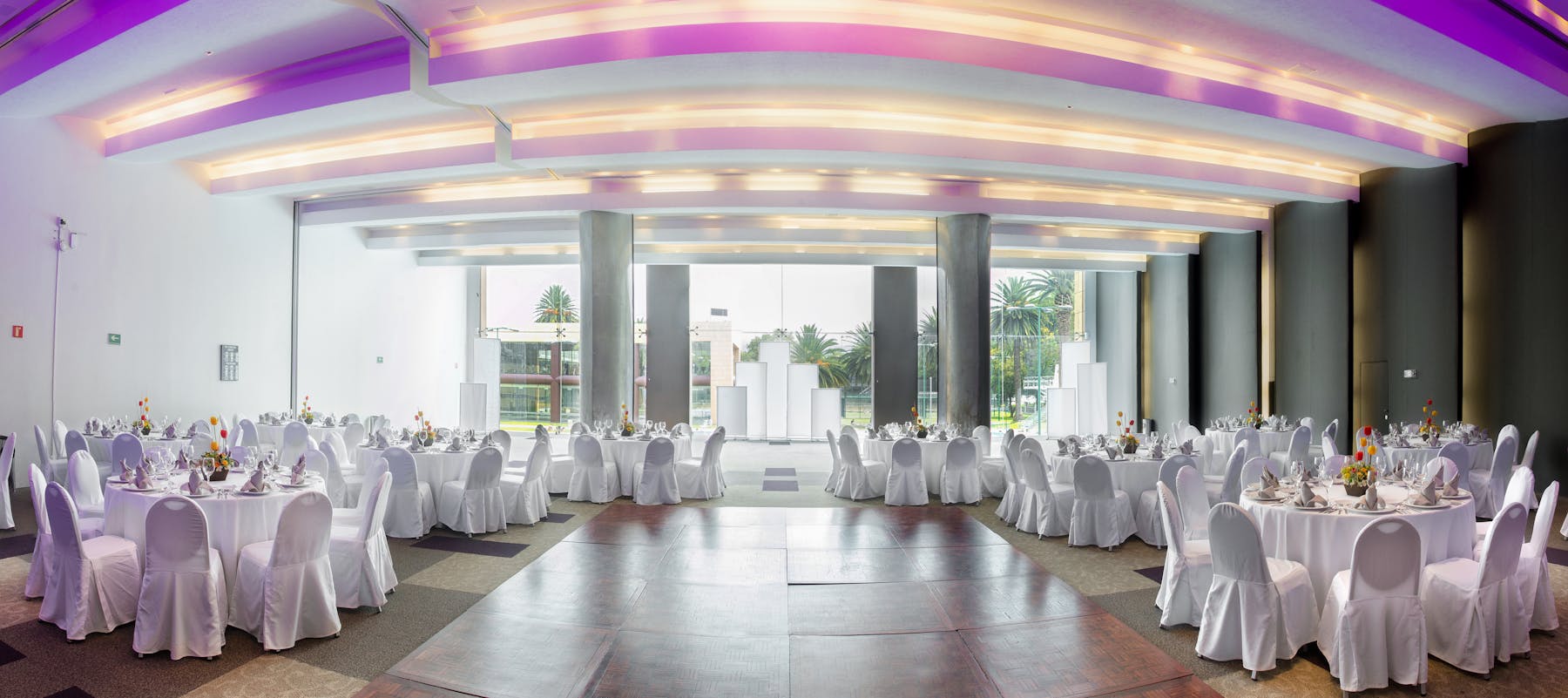 a room filled with furniture and vase on a table