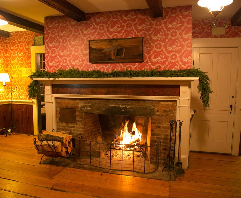 a fire place sitting in a living room with a fireplace