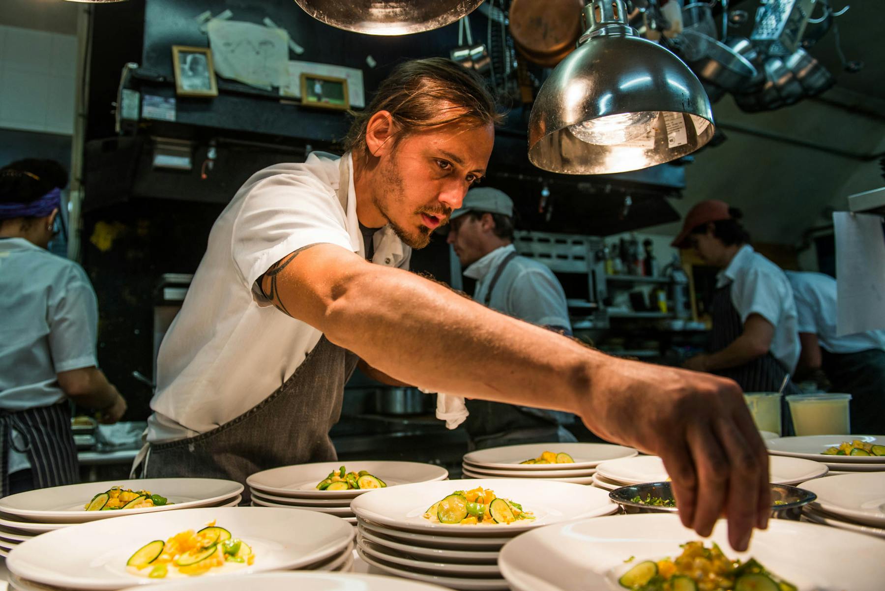 a man preparing food in a kitchen