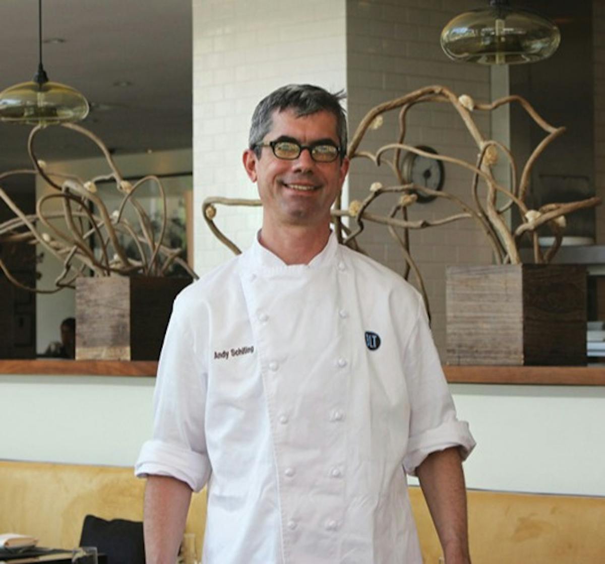 a man standing in a kitchen