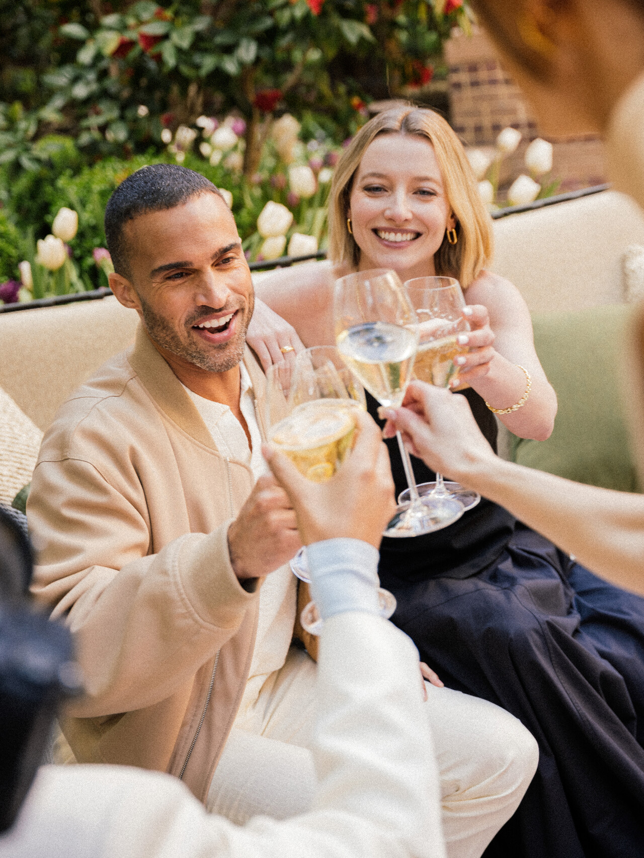 a group of people holding wine glasses
