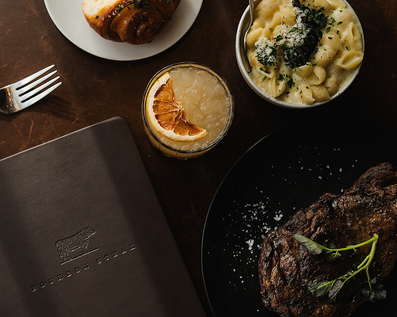 a plate of food and a book on a table