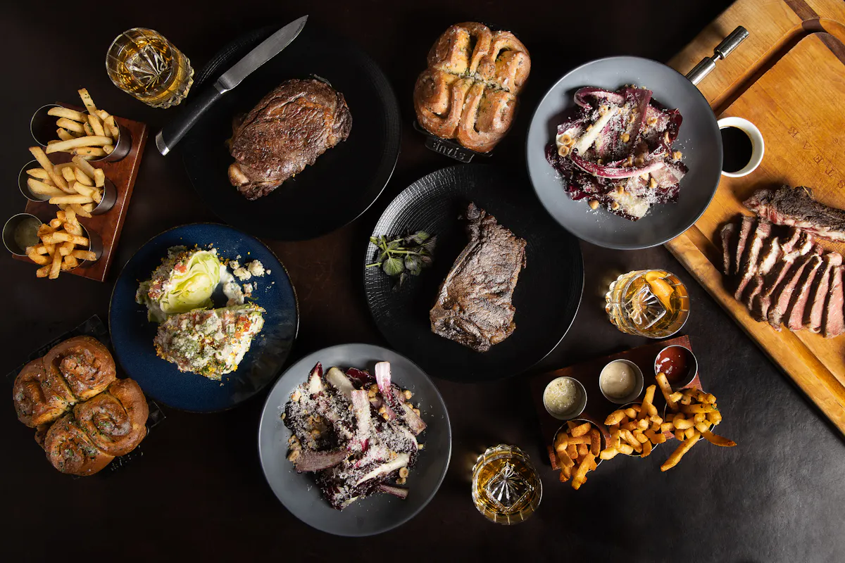 a bunch of food sitting on top of a wooden table