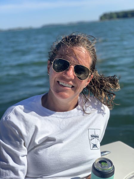 katie posing outside on a boat