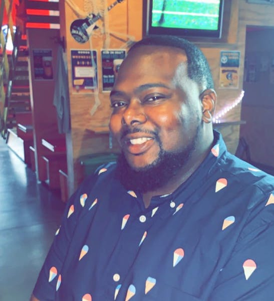 a man in a blue shirt