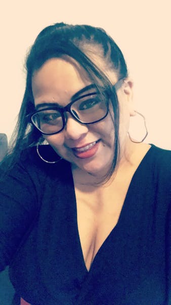 a person in glasses looking at the camera
