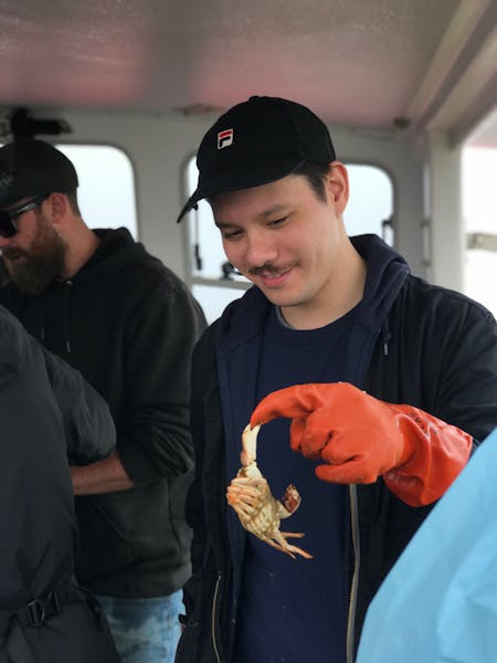 a man holding a hot dog