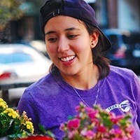 Emily looking at flowers