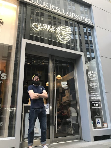 a man standing in front of a store