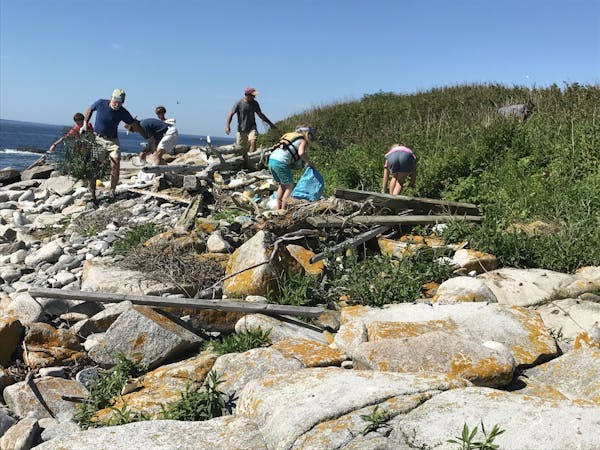 a group of people on a rock